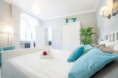 Łóżko lub łóżka w pokoju w obiekcie Apartments Madelaine Warsaw by Noclegi Renters