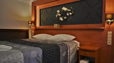 Łóżko lub łóżka w pokoju w obiekcie Hotel Złote Dęby