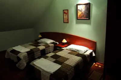 Łóżko lub łóżka w pokoju w obiekcie Hotel Złote Dęby
