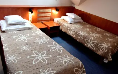 Łóżko lub łóżka w pokoju w obiekcie Hotel Złote Dęby