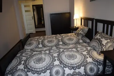 Łóżko lub łóżka w pokoju w obiekcie Fiesta Apartament