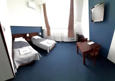 Łóżko lub łóżka w pokoju w obiekcie OSiR Polna