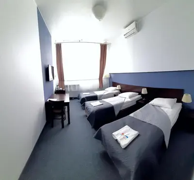 Łóżko lub łóżka w pokoju w obiekcie OSiR Polna