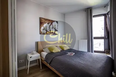 Łóżko lub łóżka w pokoju w obiekcie Chill Apartments City Link