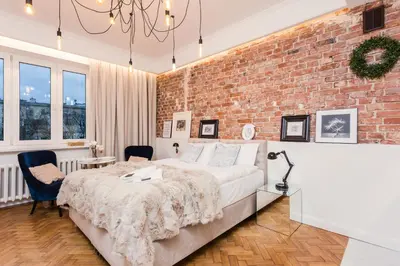 Łóżko lub łóżka w pokoju w obiekcie SleepHome Poznanska