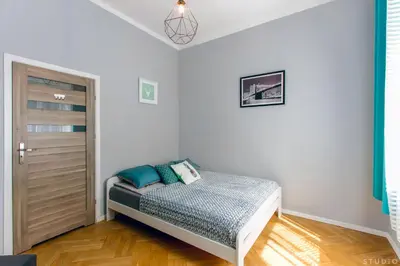 Łóżko lub łóżka w pokoju w obiekcie ClickTheFlat Wspólna Central Apart Rooms