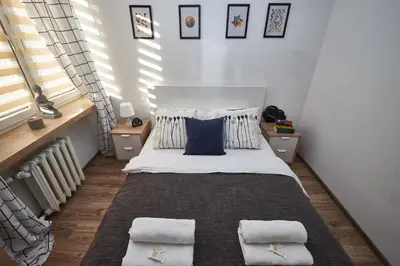 Łóżko lub łóżka w pokoju w obiekcie Noctis Apartment Pańska II