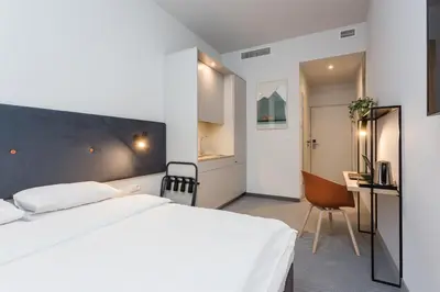 Łóżko lub łóżka w pokoju w obiekcie Platinum Hotel&Residence Wilanów