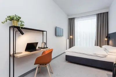 Łóżko lub łóżka w pokoju w obiekcie Platinum Hotel&Residence Wilanów