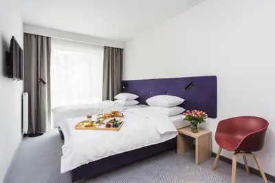 Łóżko lub łóżka w pokoju w obiekcie Platinum Hotel&Residence Wilanów