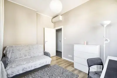 Łóżko lub łóżka w pokoju w obiekcie MG Apartments Giełdowa