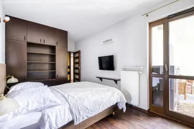 Łóżko lub łóżka w pokoju w obiekcie MG Apartments Giełdowa