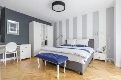 Łóżko lub łóżka w pokoju w obiekcie GLAM APARTMENTS city center