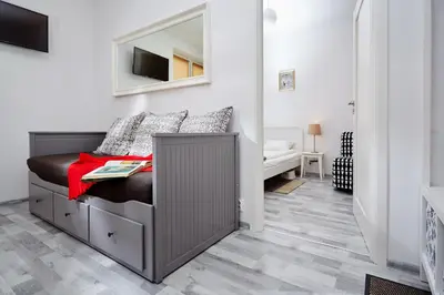 Łóżko lub łóżka w pokoju w obiekcie Marszałkowska Apartament