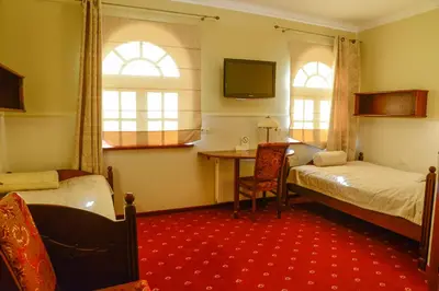 Łóżko lub łóżka w pokoju w obiekcie Nature Clinic Park Hotel
