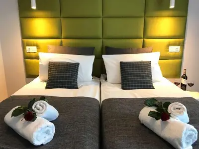 Łóżko lub łóżka w pokoju w obiekcie Premium Apartment - Chopin AirPort
