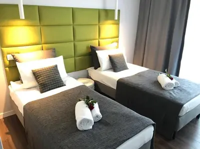 Łóżko lub łóżka w pokoju w obiekcie Premium Apartment - Chopin AirPort