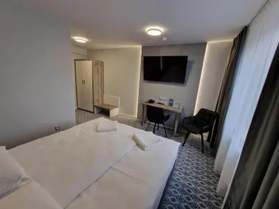 Łóżko lub łóżka w pokoju w obiekcie Hotel Gordon