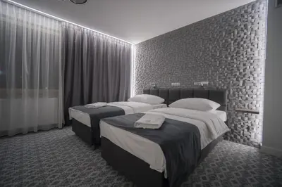 Łóżko lub łóżka w pokoju w obiekcie Hotel Gordon
