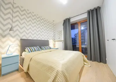 Łóżko lub łóżka w pokoju w obiekcie ShortStayPoland Kieslowskiego (B41)