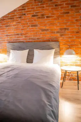 Łóżko lub łóżka w pokoju w obiekcie Moon Hostel Warszawa