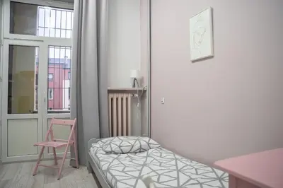 Łóżko lub łóżka w pokoju w obiekcie Moon Hostel Warszawa