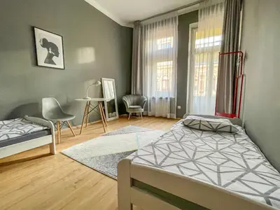 Łóżko lub łóżka w pokoju w obiekcie Moon Hostel Warszawa