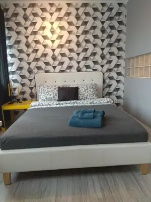Łóżko lub łóżka w pokoju w obiekcie Apartament Pańska
