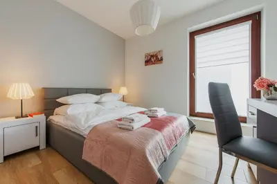 Łóżko lub łóżka w pokoju w obiekcie P&O Serviced Apartments Solec