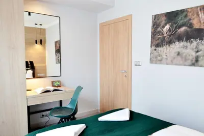 Łóżko lub łóżka w pokoju w obiekcie Smart2Stay Apartamenty