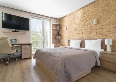 Łóżko lub łóżka w pokoju w obiekcie Royal Garden Apartment