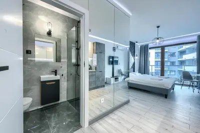 Łóżko lub łóżka w pokoju w obiekcie Kazou Residence Arkadia