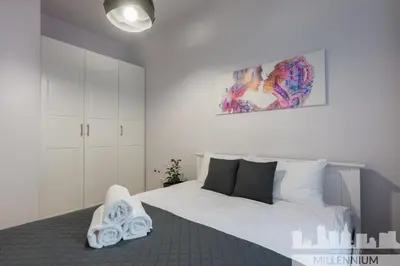 Łóżko lub łóżka w pokoju w obiekcie Millennium Awangarda Grey