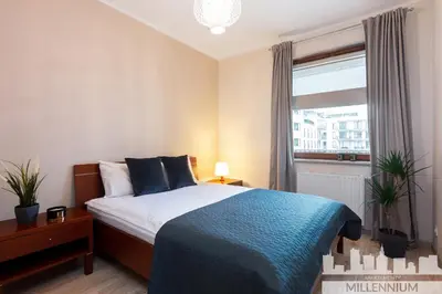 Łóżko lub łóżka w pokoju w obiekcie Millennium Awangarda Mint