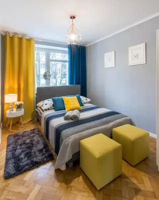Łóżko lub łóżka w pokoju w obiekcie ClickTheFlat Żurawia Street Apart Rooms