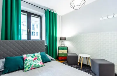 Łóżko lub łóżka w pokoju w obiekcie ClickTheFlat Wilcza Street Apart Rooms