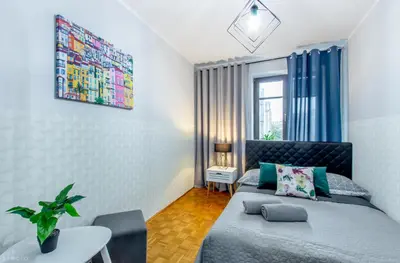 Łóżko lub łóżka w pokoju w obiekcie ClickTheFlat Wilcza Street Apart Rooms