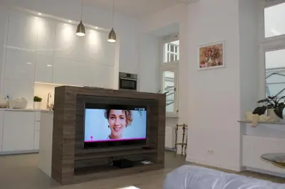 Telewizja i/lub zestaw kina domowego w obiekcie Lovely apartment- Poznanska 16