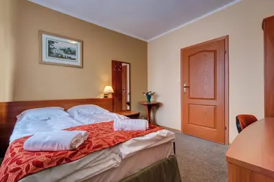 Łóżko lub łóżka w pokoju w obiekcie Villa Plaza