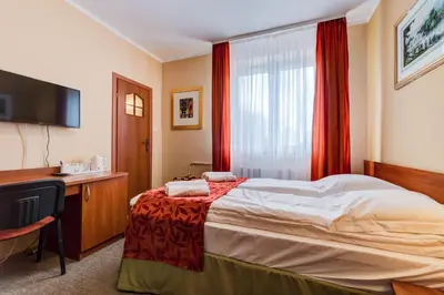Łóżko lub łóżka w pokoju w obiekcie Villa Plaza