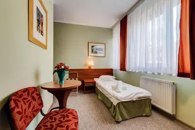 Łóżko lub łóżka w pokoju w obiekcie Villa Plaza