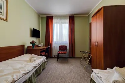 Łóżko lub łóżka w pokoju w obiekcie Villa Plaza