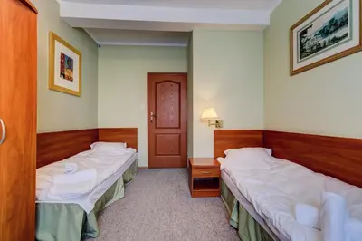 Łóżko lub łóżka w pokoju w obiekcie Villa Plaza