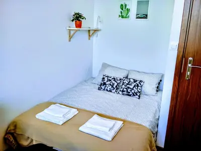 Łóżko lub łóżka w pokoju w obiekcie Vitalia Apart Rooms Bobrowiecka