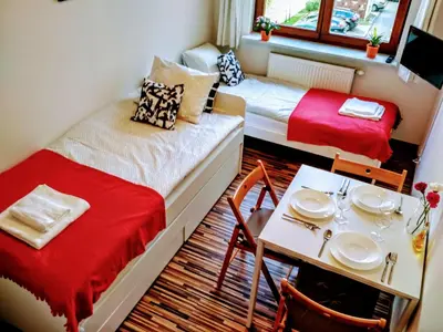 Łóżko lub łóżka w pokoju w obiekcie Vitalia Apart Rooms Bobrowiecka
