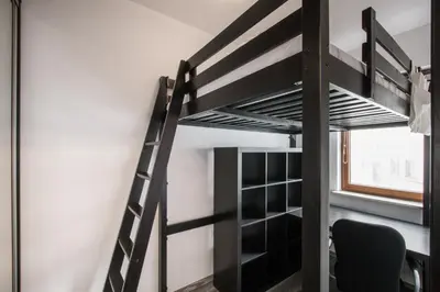 Łóżko lub łóżka piętrowe w pokoju w obiekcie P&O Serviced Apartments GOCLAW