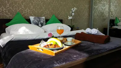 Łóżko lub łóżka w pokoju w obiekcie Dekart Arkadia Apartments