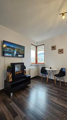 Telewizja i/lub zestaw kina domowego w obiekcie Dekart Arkadia Apartments