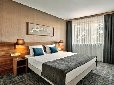 Łóżko lub łóżka w pokoju w obiekcie Arche Hotel Puławska Residence Warszawa