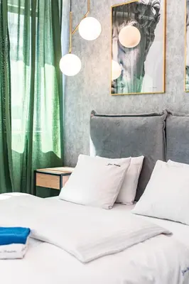 Łóżko lub łóżka w pokoju w obiekcie Apartament Moniuszki by Your Freedom